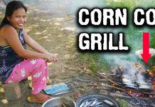 Cooking Fish On Corn Cob Pellet Grill in Philippines Village Cooking Fish On Corn Cob Pellet Grill in Philippines Village