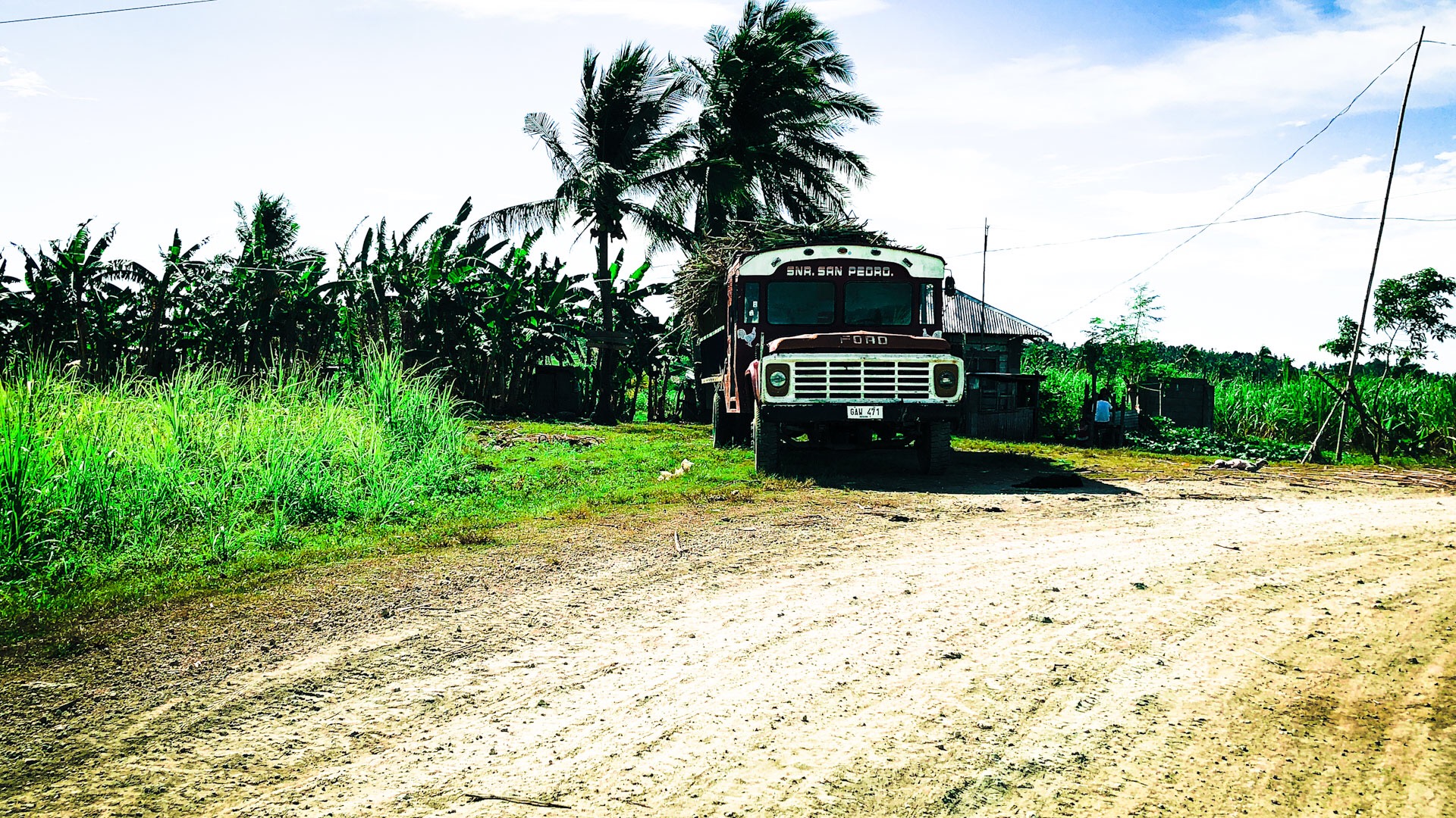 Take a ride with us on the motorbike as we leave the village and venture through the beauty of the sugar cane fields.